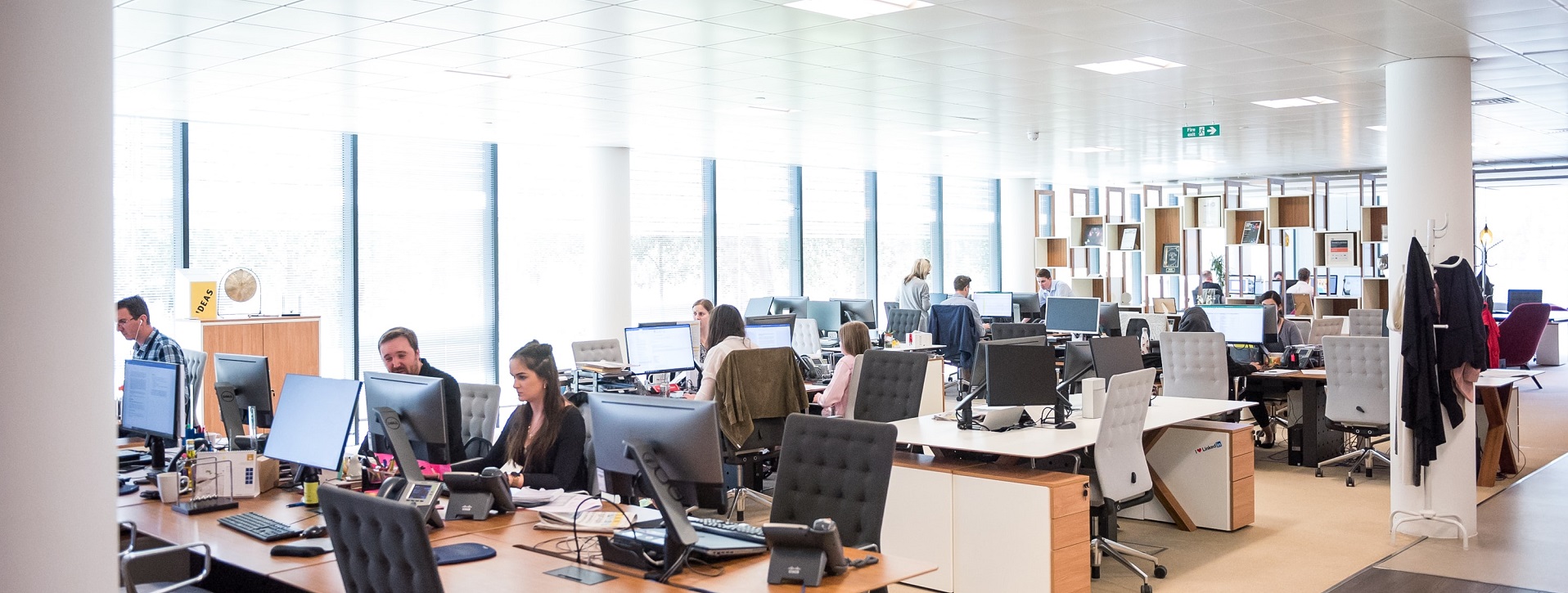 Photo of busy call centre with multiple employees