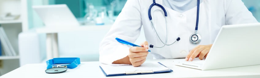Doctor making notes