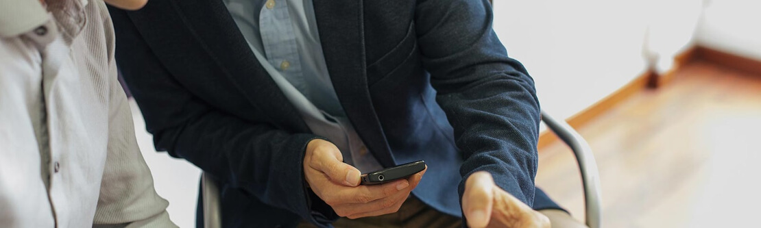 two people looking at a phone together