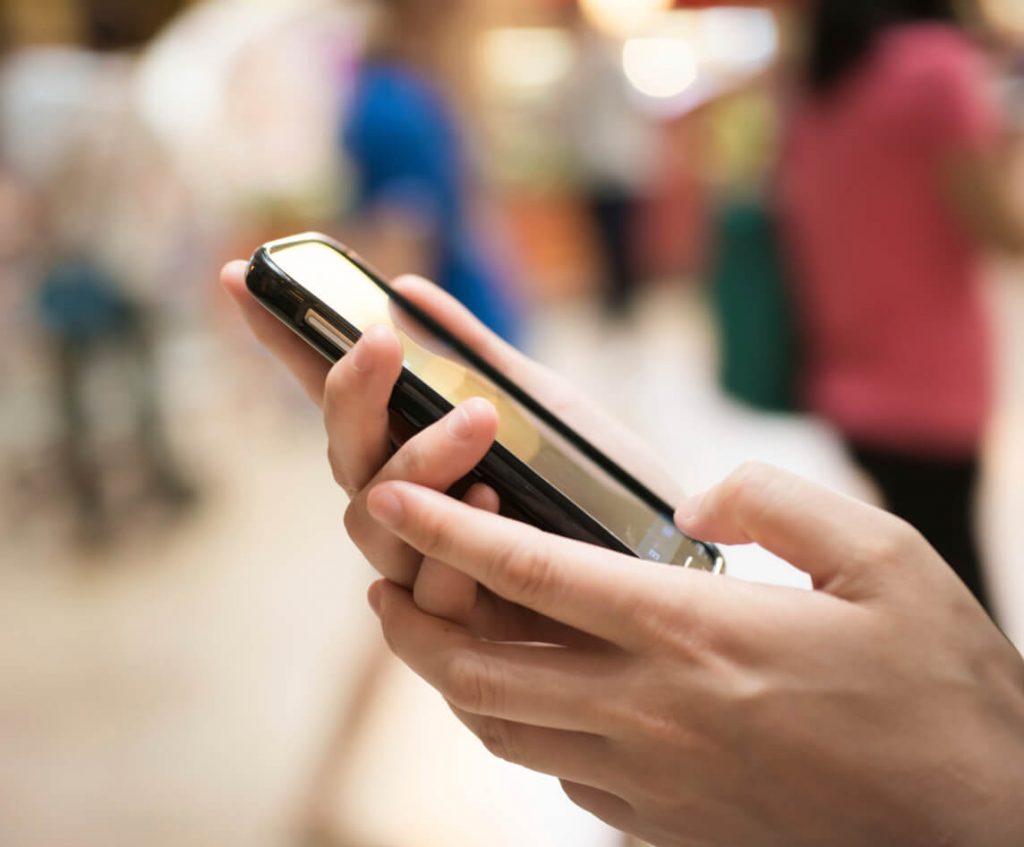 woman holding a phone
