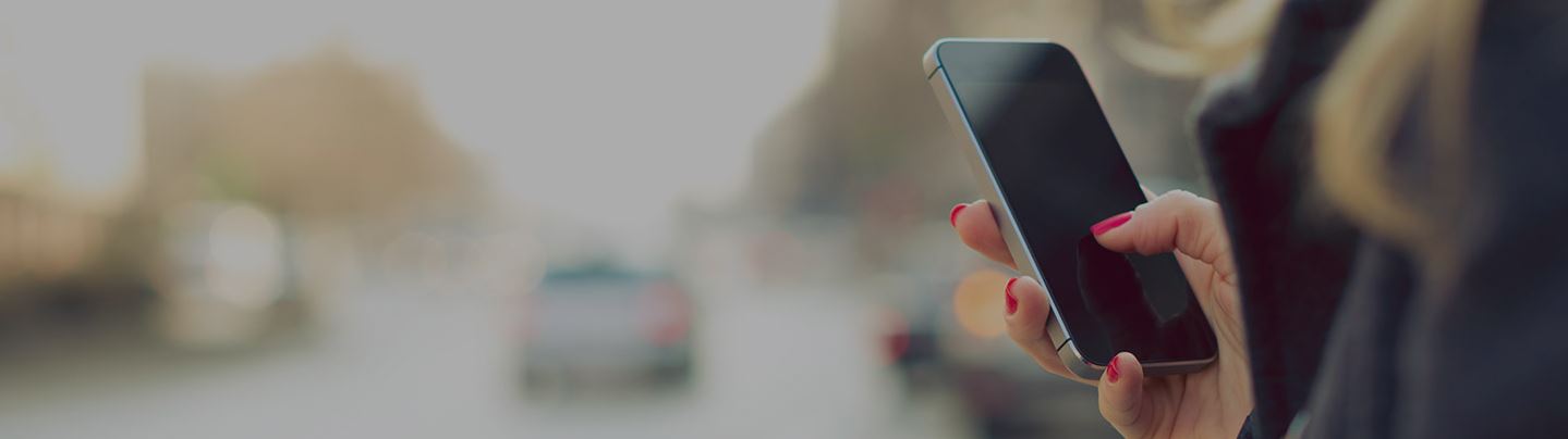 woman using mobile phone in hand